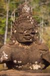 Statue Of Ancient Khmer Warrior Head At Angkor Wat Stock Photo