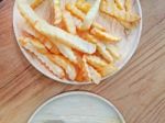 Traditional French Fries On Wood Background Stock Photo