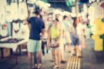 Blurred People Walking In The Market Stock Photo