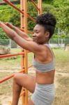 Young African Woman Doing Stretching Stock Photo