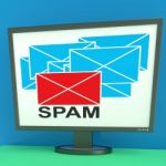 Spam Envelope On Monitor Shows Junk Mail Stock Photo