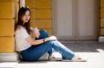 Portrait Of Thai Chinese Adult Beautiful Girl Denim Blue Bag Relax And Smile Stock Photo