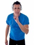 Young Guy Enjoying Music Silently Stock Photo