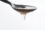 Honey On A Spoon Stock Photo