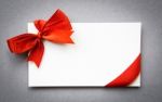 Card With Red Ribbons Bows Stock Photo