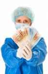 Surgeon Holding Banknotes Stock Photo