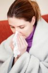 Woman Sneezing In The Handkerchief Stock Photo