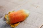 Papaya On Wooden Floor Stock Photo