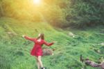 Summer Portrait Of Young  Women Enjoying Nature  In Tight Fitting Red Dress Summer Vacation,sunny,having Fun, Positive Mood,romantic, Against Background Of Summer Green Park, Green Leaves Stay Outdoor Stock Photo