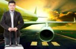 Young Business Man And Traveling Luggage Standing In Front Of Pa Stock Photo