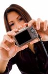 Attractive Woman Holding Camera Stock Photo