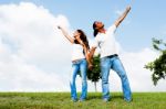 Couple Posing Under Sky Stock Photo