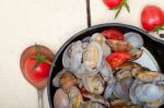 Fresh Clams On An Iron Skillet Stock Photo