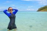 Asian Teen Girl Is Relax In The Sea During Travel To Ko Lipe, Thailand Stock Photo