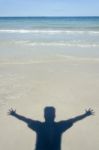 Shadow Man On Beach Stock Photo