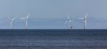 Wind Turbines Off Shore At Colwyn Bay Stock Photo