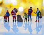 Miniature Santa Claus And Family With Beautiful Light Bokeh Back Stock Photo