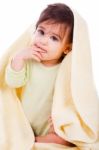 Innocent Baby Wrapped With A Yellow Towel Stock Photo