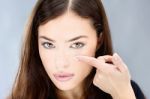 Woman Hold Contact Lens On Finger Stock Photo