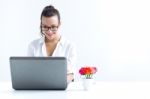 Woman With Laptop Working At Home Stock Photo