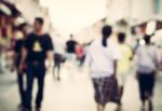 Blurred People Walking On The Street Of Old Town Stock Photo