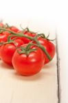 Fresh Cherry Tomatoes On A Cluster Stock Photo