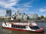 Tourist Boat Cruising Along The River Thames Stock Photo