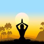 Yoga Pose Means Scenic Green And Meditate Stock Photo