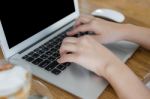 Closeup Of Business Woman Hand Typing On Laptop Keyboard Stock Photo