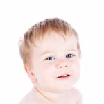 Toddler Blond And Blue Eyes Boy Child With Various Facial Expres Stock Photo