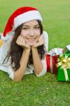 Santa Claus Hat With Red Christmas Gift Box Stock Photo