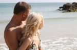 Young Couples At Beach Stock Photo