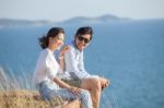 Portrait Of Asian Younger Man And Woman Relaxing Vacation At Sea Side Happiness Emotion Stock Photo