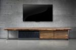 Led Tv On Concrete Wall With Wooden Furniture In Living Room Stock Photo