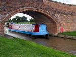 Narrow Boat Travelling Along The Shropshire Union Canal Stock Photo