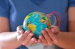 Hand Holding Globe Stock Photo