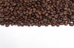 Roasted Coffee Beans On White Stock Photo