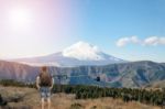 Backpacker Standing And Looking At The Mount Fuji Stock Photo