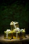 Gift Box On Old Wooden With Green Bokeh Background Stock Photo