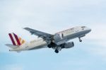 Airplane Taking Off On A Cold Winter Day In Stuttgart, Germany Stock Photo