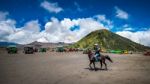 Java,indonesia-arpil 24,2017 : A Horseman At Mount Bromo Of Bromo-tengger-semeru National Park In Indonesia Stock Photo