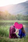 Loving Couple. Beautiful Young Love Couple Holding Paper Hearts Stock Photo