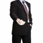 Some Unrecognizable Businessman In Suit Showing  A Spread Of Cas Stock Photo