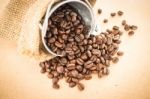 Coffee Roasted Bean In The Bucket On Wooden Background Stock Photo