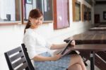 Portrait Of Thai Adult Businesswoman Beautiful Girl Using Her Tablet Stock Photo