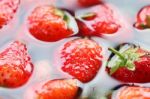 Strawberry In Water Background Stock Photo