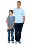 Casual Studio Shot Of Father And Son Stock Photo