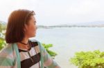 Woman Looking At The Sea Stock Photo