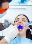 Cute Young Woman At The Dentist. Mouth Checkup Stock Photo