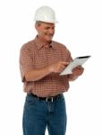 Senior Engineer Using Tablet Stock Photo